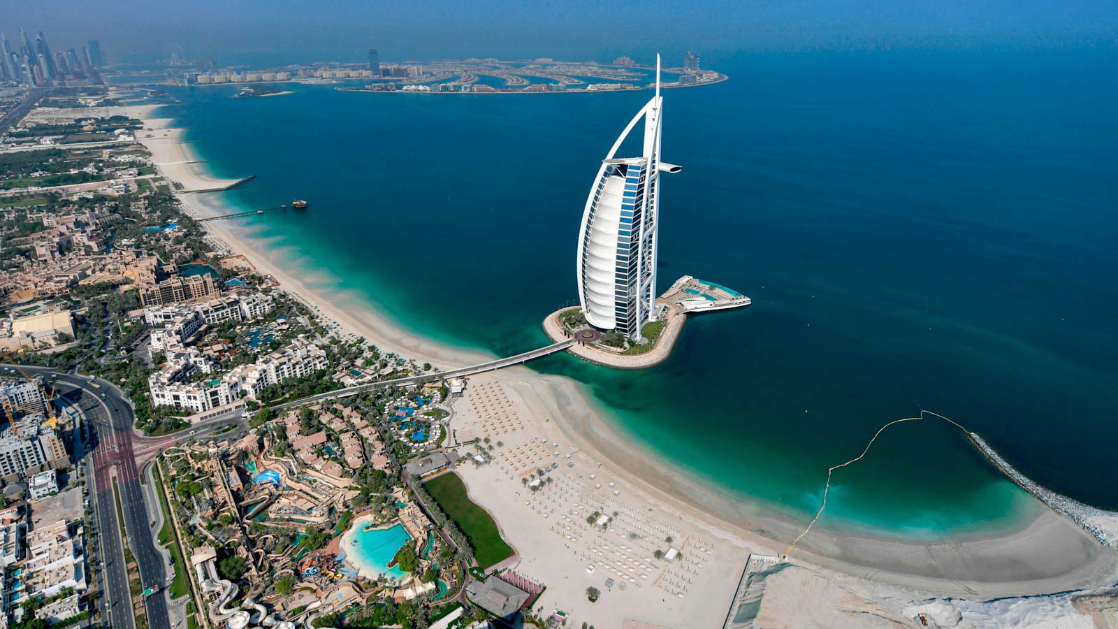UAE-TOURISM-HEALTH-VIRUS This picture taken on July 8, 2020 shows an aerial view of the Burj al-Arab hotel in the Gulf emirate of Dubai, during a government-organised helicopter tour. (Photo by KARIM SAHIB / AFP) (Photo by KARIM SAHIB/AFP via Getty Images)